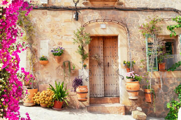 Fototapeta na wymiar wall with traditional flower pots in old town of Valdemossa, Majorca, Spain