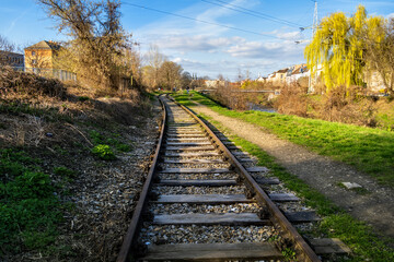 Old railway tracks on the bank of the river in the industrial part of the city of Brno, Czech Republic