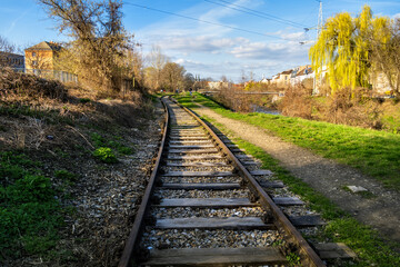 Old railway tracks on the bank of the river in the industrial part of the city of Brno, Czech...