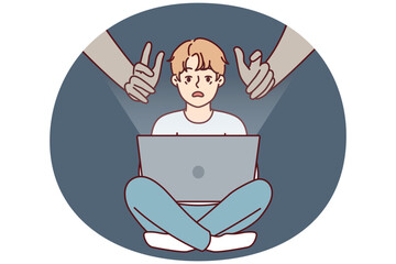 Giant hands reaching out to teenage boy using laptop with internet without parental control. concept of danger of using gadgets by children due to possibility of identity theft - obrazy, fototapety, plakaty