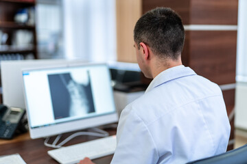 Doctor working in modern hospital office. Computer medical healthcare specialist.