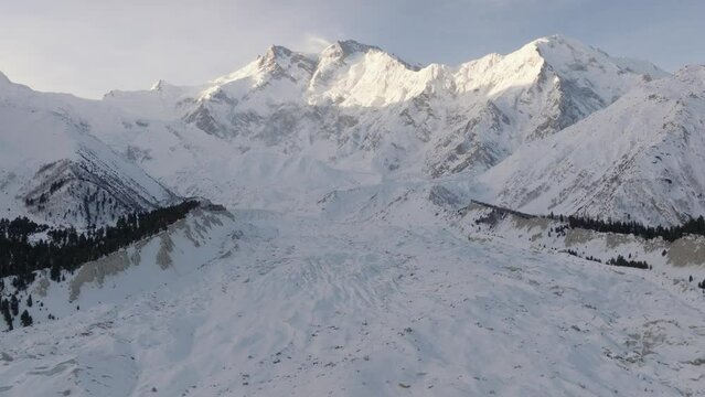Snowy Nanga Parbat at Winter. Aerial Drone Shot with a glacier in valley, Fairy Meadows Pakistan, Mount Killer at Dawn