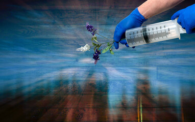 A syringe with flowers. Homeopathy concept.2