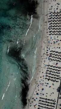 Aerial view 90 degrees. Mallorca. Spain. Sa Coma beach. Transparent water. Vertical video for social network.Tilt 4K