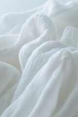 Close up of a white blanket on a bed, perfect for home decor projects