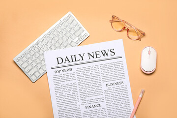 Newspaper with computer mouse, keyboard and eyeglasses on beige background - obrazy, fototapety, plakaty