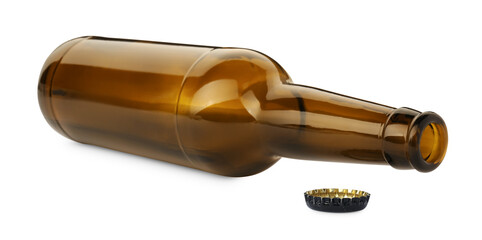 One empty brown beer bottle and cap isolated on white