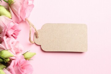 Happy Mother's Day. Beautiful flowers and blank card on pink background, flat lay