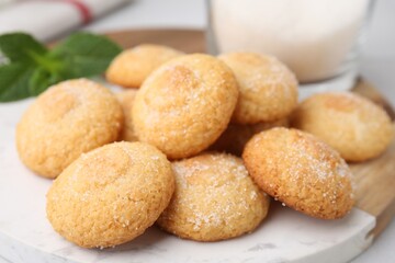 Tasty sweet sugar cookies on table, closeup