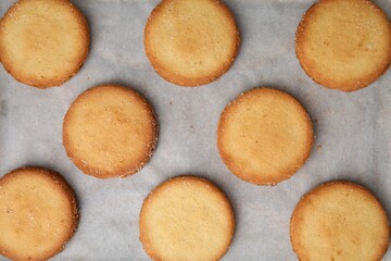 Tasty sweet sugar cookies on tray, top view