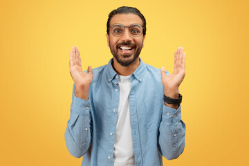 Excited man showing something big with hands