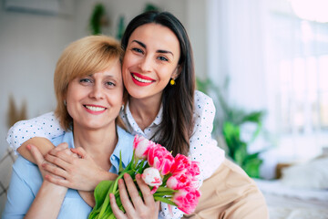 Close up photo of loving young adult female daughter congratulate her mature mother with mothers day. Birthday, Mothers day, women's day, retired, family, relation, motherhood. - 773486016