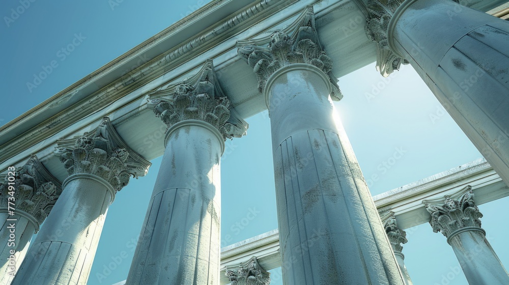 Poster A group of columns with a sky in the background. Perfect for architectural design projects