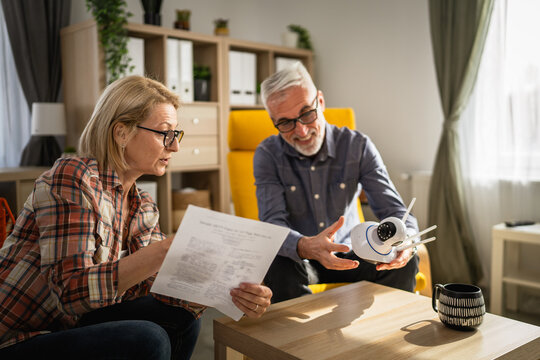 Couple at home connect and install cctv security surveillance camera