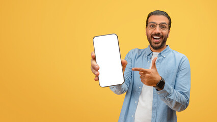 Man pointing at phone screen with smile