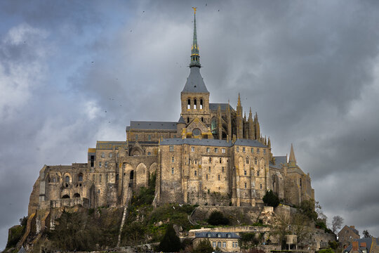 Mont Saint Michel with dark grey sky 