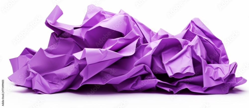 Poster a piece of crumpled purple paper is placed on a plain white background with no patterns or distracti