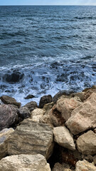 Waves crashing against the rocks of the coast of Malaga