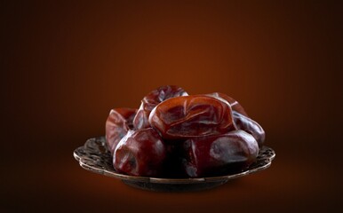 Dried tasty sweet dates fruits in bowl