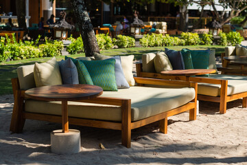 Stylish beach loungers for relaxing near the coastline, on the hotel grounds among the greenery.