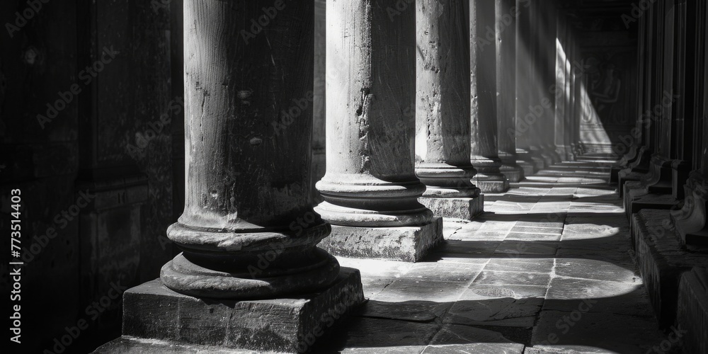 Poster A black and white photo of a row of columns. Suitable for architectural design projects