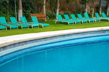 lounge chairs in a swimming pool invite you to relax