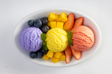  ice cream with fresh berries in a bowl  isolated on white background