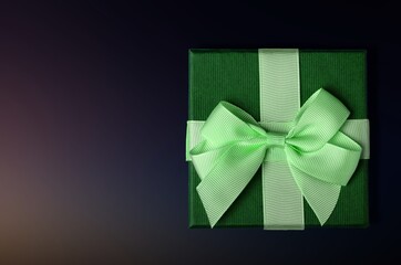 Colored gift box with ribbon baw