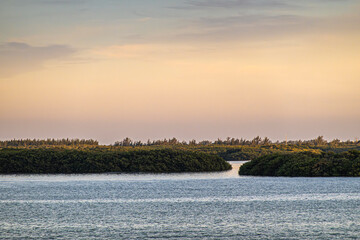 Miami, Florida, USA - July 29, 2023: Virginia Key island NW side. Canal through green shoreline to...