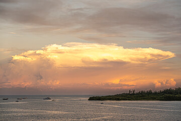 Miami, Florida, USA - July 29, 2023: Small boats and Mushroom sunset cloud over north side Virginia...