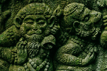 Monkey relief carving in Monkey Forest, Ubud, Bali, Indonesia.
