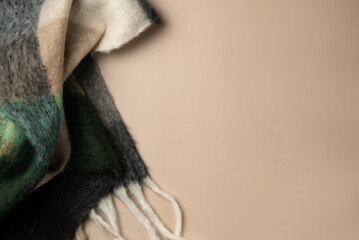 Beige background with soft scarf. Copy space