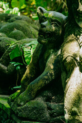 Fototapeta na wymiar Statue in the Monkey Forest, Ubud, Bali, Indonesia.