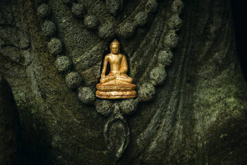Gold buddha mini statue in a temple, Ubud, Bali, Indonesia