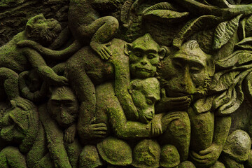 Relief carving of Monkeys in Monkey Forest. Ubud, Bali, Indonesia.