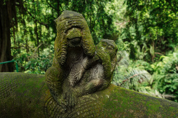 Naklejka na ściany i meble Sculpture of Monkey in the Monkey Forest. Ubud, Bali, Indonesia.