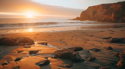 Golden Sunset on a Serene Beach with Waves and Rocky Cliffs