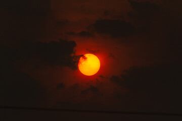 Sunset in the evening sky. Beautiful nature background with sun.