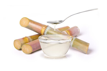 Sugar syrup and sugar cane isolated on white background.