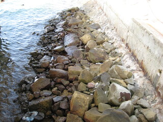 rocks protecting and supporting a seawall