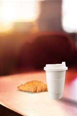 Levitating food. fresh croissants and coffee cup