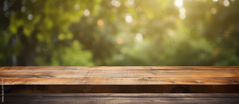 Poster wooden table top shown with a soft focus forest backdrop, creating a rustic and serene setting