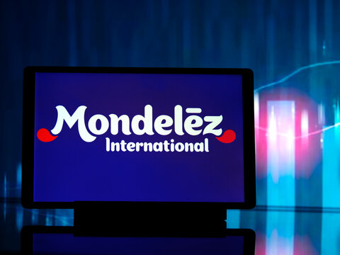 In this photo illustration,  Mondelēz International, Inc.  logo seen displayed on a tablet
