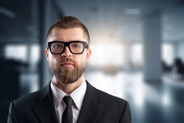 Happy business man investor posing in office