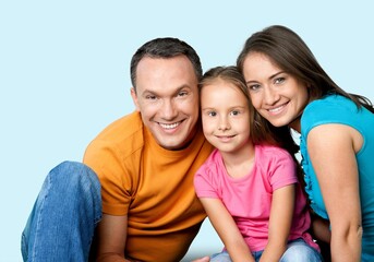 Happy young family with child on background