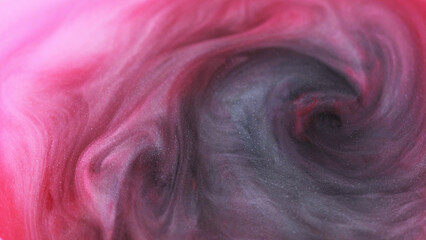 Liquid glitter mix. Color smoke. Art swirl. Defocused red black pink spiral haze ink water cloud...