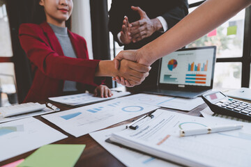 Business team shaking hands and clapping after a business deal Image of business partners...