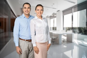 Two happy professional business leaders in office