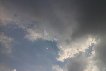 Natural daylight and white clouds floating on blue sky.