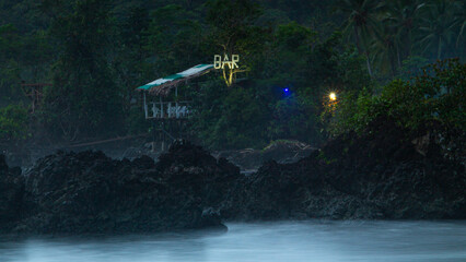 Whispering Waters: Mystical Bar Amidst Misty Waves